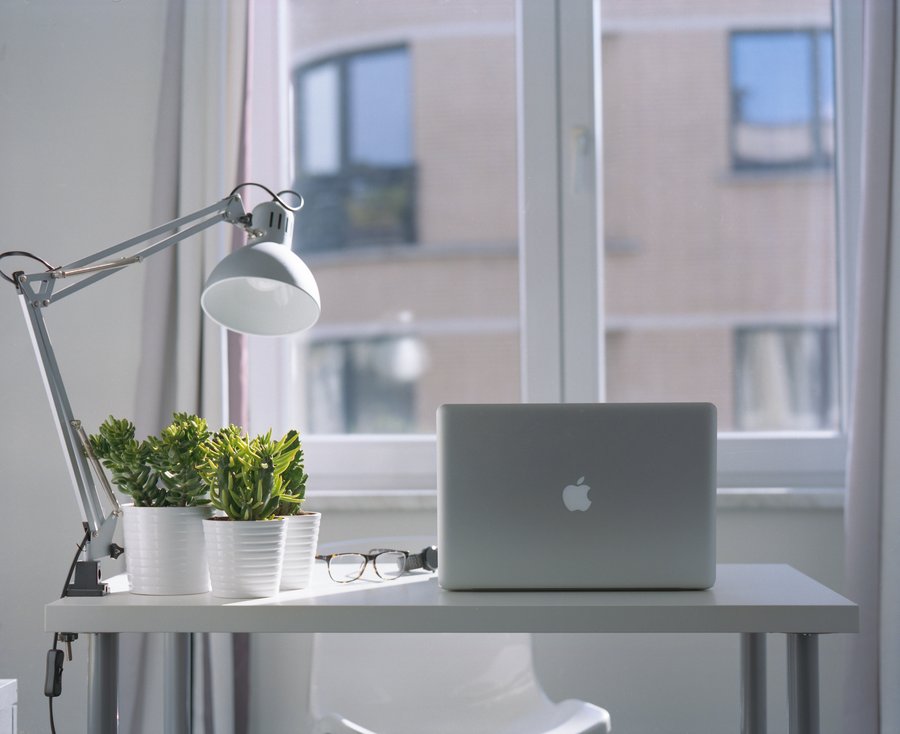 MacBook on a clean desk setup for focused productivity work